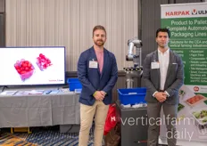Joey Schmidt and Carlo Bergonzi with Harpak Ulma, showing off their packaging robot 